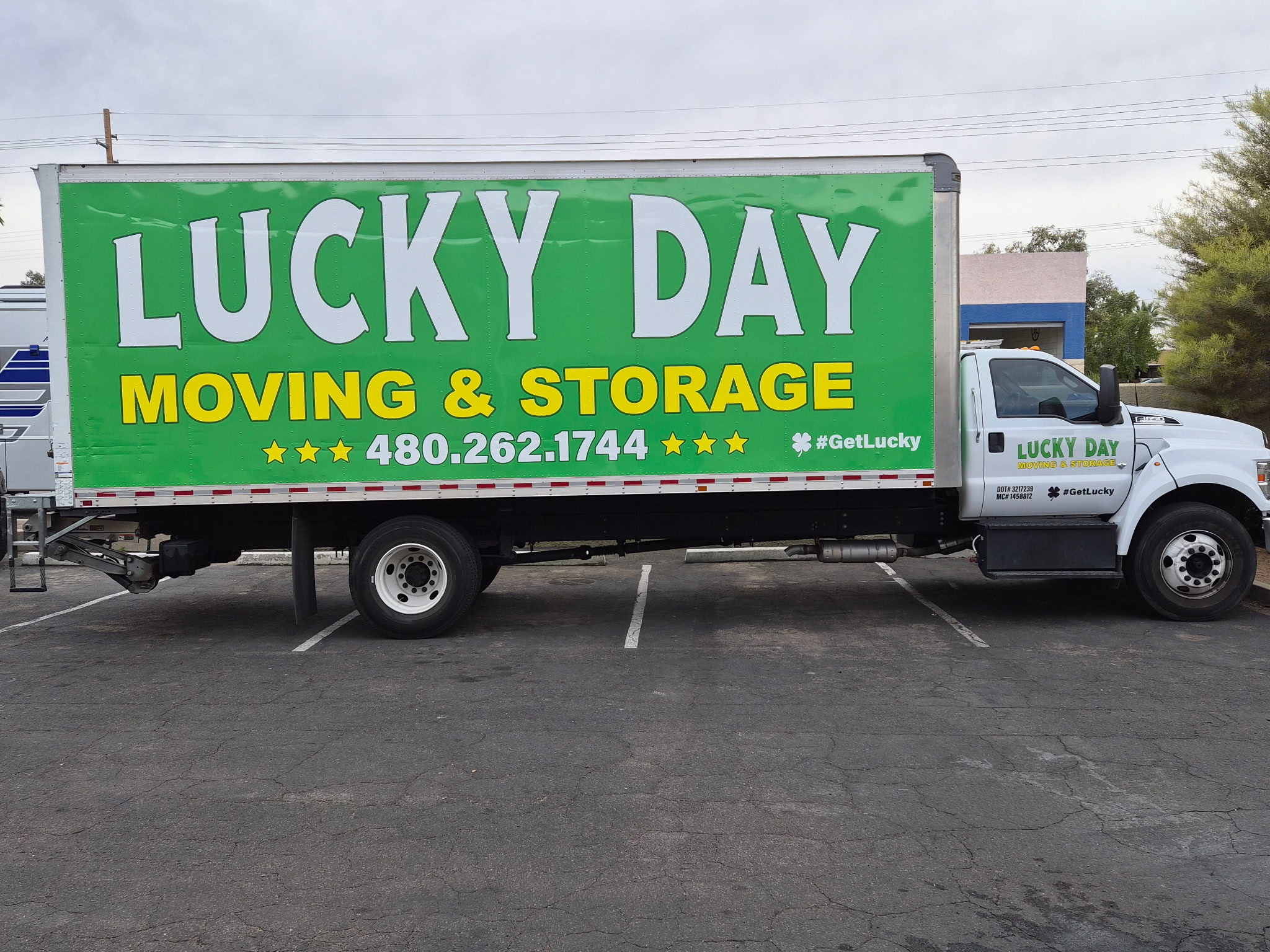 Lucky Day Moving crew unloading furniture from a moving truck