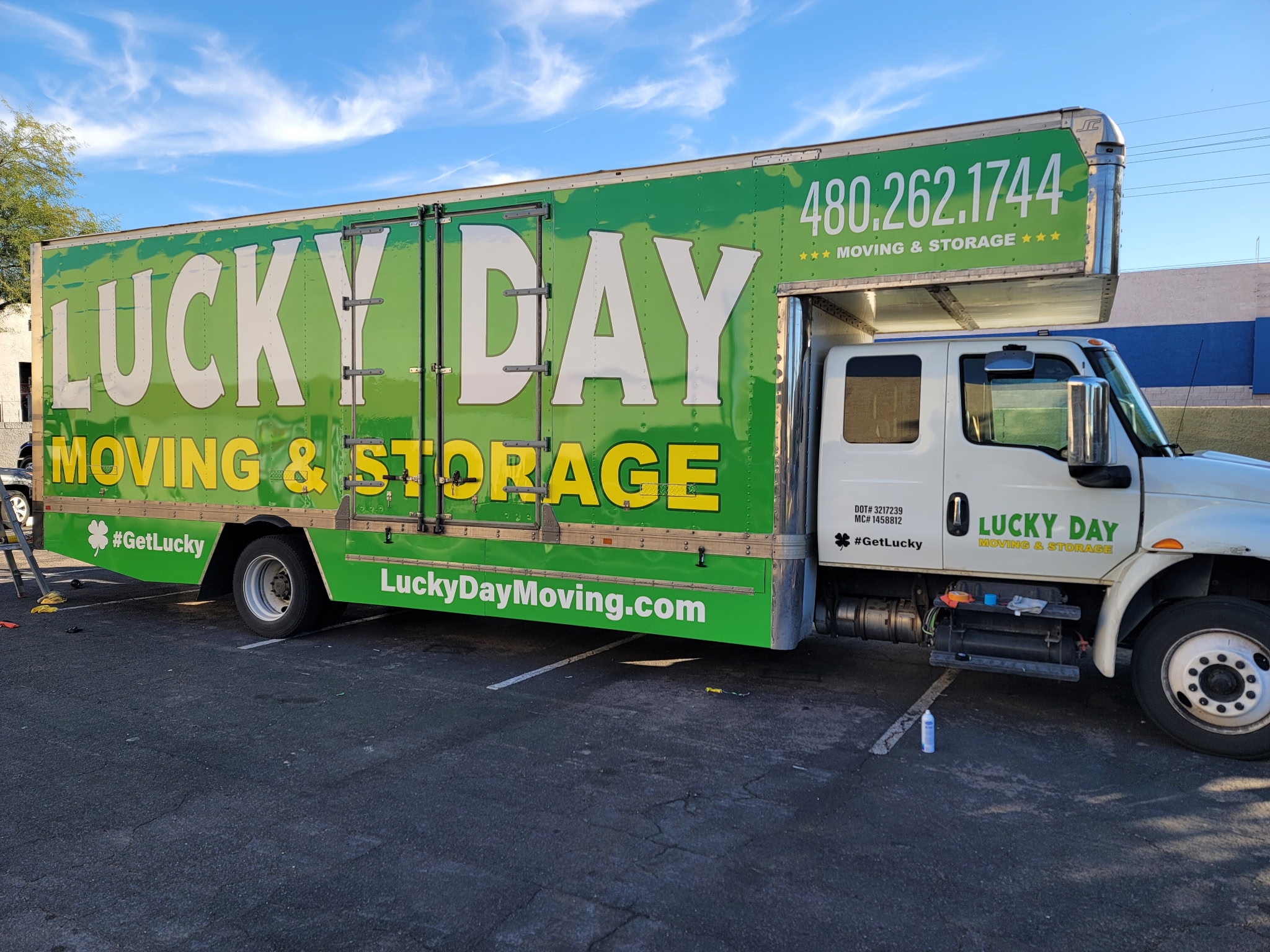 Moving crew unloading boxes from a van — flexible storage services